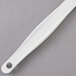 A white Rubbermaid silicone spatula.