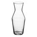 A clear glass carafe with a small opening.