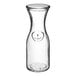 A clear glass Libbey wine decanter.