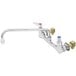 A T&S chrome wall mount pantry faucet with two handles.