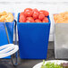 Three blue Tablecraft containers with food in them on a table in a salad bar.