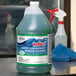 A green bottle of Noble Chemical Reflect Super Concentrated Window Cleaner.