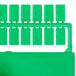 A green rectangular plastic case with six green plastic clips inside.