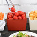 A Tablecraft copper bowl with tomatoes and croutons.