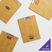 A Choice customizable natural wood menu holder with a logo on it.