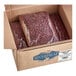 A box full of 20 lbs of dried small red beans.