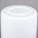 A white plastic container with a circular lid.