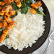 A plate of Regal White Basmati Rice and meat with spinach.