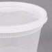 A Pactiv translucent round deli container with a lid.