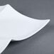 A white CAC porcelain divided tasting plate.