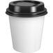 A white Choice paper hot cup with a black lid.