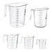 A group of clear polycarbonate measuring cups with handles and blue and red writing.