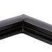 The black corner of a True 810773 equivalent magnetic door gasket.