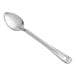 A Vollrath stainless steel basting spoon with a handle.