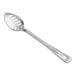 A Vollrath stainless steel slotted basting spoon with a handle.