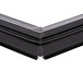 A black magnetic bottom door gasket with a black frame on a True refrigeration unit.