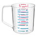 A clear Rubbermaid Bouncer measuring cup with red and blue measurements.