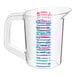 A clear Rubbermaid measuring cup with blue and red writing.