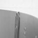 A close-up of a Vollrath metal hooked handle solid spoon.
