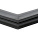 A close-up of a black plastic magnetic door gasket corner.
