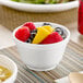 A close-up of a bowl of soup in a white Dart foam bowl.