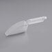 A clear plastic scoop with a handle.