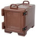 A dark brown plastic Cambro food pan carrier with black handles.