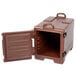 A dark brown Cambro front loading insulated food pan carrier with an open door.