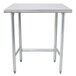 An Advance Tabco stainless steel work table with metal legs.