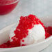 A bowl of ice cream with red Regal Maraschino Cherries on top.