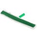 a green mop with a handle