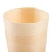 A close-up of a Tablecraft mini wooden serving cup with a curved surface.