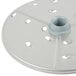 A white circular Robot Coupe food processor disc with holes.