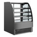 A black Structural Concepts refrigerated bakery display case with curved glass shelves.