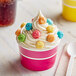 A cupcake with Albanese Sour Gummi Poppers on top.
