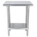 A stainless steel Advance Tabco work table with a stainless steel undershelf.