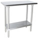 A stainless steel Advance Tabco work table with a stainless steel shelf.