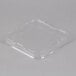A Solut clear plastic low dome lid on a clear plastic container.