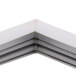 A close-up of a white metal corner frame for a Continental Refrigerator Magnetic Door Gasket.