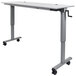 A grey rectangular Luxor adjustable height flip top nesting table on wheels.