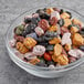 A glass bowl of Chocolate Rocks topping on a table.