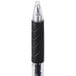 The black and silver Universal One medium point gel pen in a black plastic container.