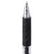 A close-up of a black and silver Universal One retractable rollerball gel pen.