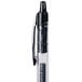 A close-up of a Universal One black medium point gel pen with a black tip.