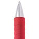 A close-up of a red Universal medium point rollerball gel pen with a silver tip.