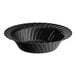 A black plastic bowl with a scalloped edge.