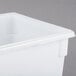 A Rubbermaid white polyethylene food storage container with a lid.