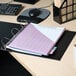 A blue Avery economy binder on a desk with a computer and a mouse, with purple paper in it.