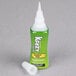 A clear plastic tube of Krazy Glue with a green label and white cap.