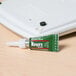 A green tube of Krazy Glue with a white cap.